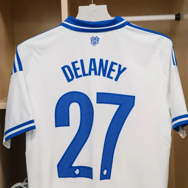 White and blue FC Copenhagen 2025-26 jersey with the name "DELANEY" and number "27" printed on the back.