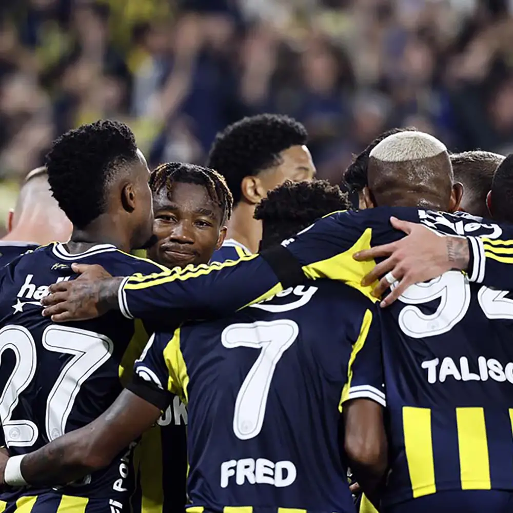 Fenerbahce 2025-26 team players celebrating – match action photo of Fenerbahce squad in 2025-26 kit (navy & yellow)