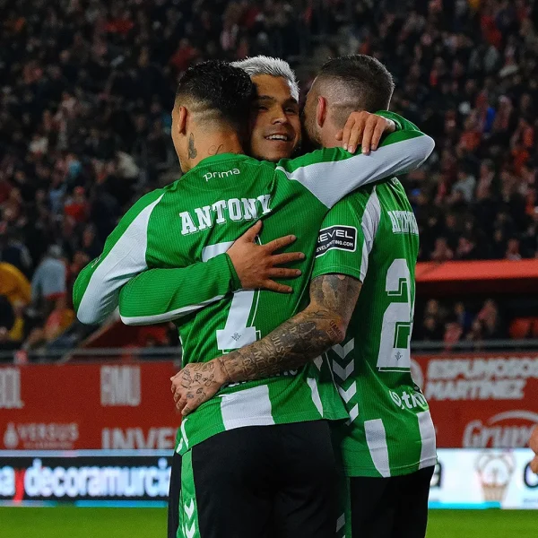 Real Betis 2025-26 Kit Font in Action Real Betis players wearing the 2025-26 kit with official name and number font.