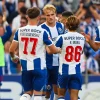 fc-porto-2026-2027-jersey-font FC Porto football players during a match showcasing numbers 77 and 86 in the FC Porto 2026-2027 font style.