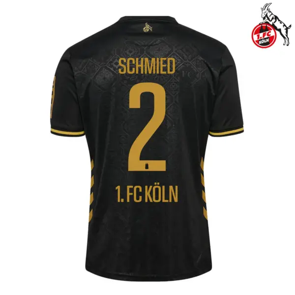 1. FC Koln 2025-2026 away font layout showing player name Schmied and number two on black gold kit