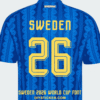 sweden-2026-world-cup-away-font-jersey-effect Sweden 2026 World Cup away font download on blue patterned away jersey with yellow chiseled number twenty six layout