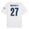 Manchester City 2026-2027 away font applied on white jersey back showing dark navy MATHEUS N. text and number 27