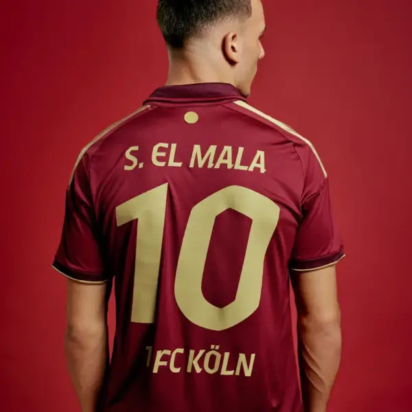 1-fc-köln-2026-2027-special-jersey Player wearing 1. FC Köln 2026-2027 Willi Ostermann special jersey with S. EL MALA 10 gold font printing
